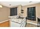 Kitchen area features granite counters, stainless steel sink and dark accents at 6401 Windsor Gate Ln, Charlotte, NC 28215