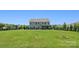 View of the backyard, showcasing a large yard, patio area, and the rear of the home at 6535 Bridgemoor Dr, Indian Trail, NC 28079