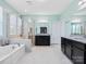 Bright, open bathroom with separate vanities, soaking tub, large shower, and granite countertops at 6535 Bridgemoor Dr, Indian Trail, NC 28079