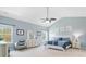 Bright bedroom with a vaulted ceiling, decorative artwork, neutral decor, and a large window at 6535 Bridgemoor Dr, Indian Trail, NC 28079