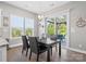 Dining area with sliding glass doors to an outdoor patio and backyard views at 6535 Bridgemoor Dr, Indian Trail, NC 28079