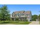 Beautiful exterior view of this two-story home with stone accents, siding, and manicured lawn at 6535 Bridgemoor Dr, Indian Trail, NC 28079