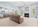 Bright living room with a fireplace, neutral decor, and open-concept design with views to the kitchen at 6535 Bridgemoor Dr, Indian Trail, NC 28079