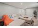 Large finished basement featuring neutral walls and large sectional at 7018 Rollingridge Dr, Charlotte, NC 28211