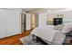 View of the finished basement bedroom with hardwood floors, closet space, and a safe at 7018 Rollingridge Dr, Charlotte, NC 28211