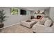 Finished basement with fireplace and a large wall-mounted television at 7018 Rollingridge Dr, Charlotte, NC 28211