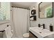 Modern bathroom featuring a sleek vanity, white fixtures, and natural light at 7018 Rollingridge Dr, Charlotte, NC 28211