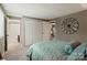 Bedroom view with large closet, neutral walls, and ensuite access to bathroom at 7018 Rollingridge Dr, Charlotte, NC 28211