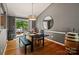 Dining area featuring a modern chandelier and access to an outdoor deck at 7018 Rollingridge Dr, Charlotte, NC 28211