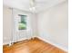 Bright bedroom with hardwood floors and a large window offering natural light at 7022 Lakeside Dr, Charlotte, NC 28215