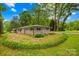 Charming single-story home with a well-maintained lawn and landscaped garden beds, offering great curb appeal at 7022 Lakeside Dr, Charlotte, NC 28215