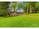 Charming single-story home with a well-maintained lawn and mature trees at 7022 Lakeside Dr, Charlotte, NC 28215