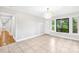Bright living room with tile floors and modern lighting at 7022 Lakeside Dr, Charlotte, NC 28215