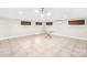 Bright living room features recessed lighting, large windows, and a glass table, perfect for entertaining at 7022 Lakeside Dr, Charlotte, NC 28215