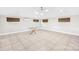 Bright living room features recessed lighting, large windows, and a glass table, perfect for entertaining at 7022 Lakeside Dr, Charlotte, NC 28215