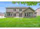 Expansive backyard with manicured lawn, perfect for gatherings and outdoor enjoyment at 8070 Clems Branch Rd, Indian Land, SC 29707