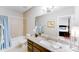 Bathroom with tile floors, a shower-tub combo, and a vanity, providing essential amenities and decor at 8070 Clems Branch Rd, Indian Land, SC 29707
