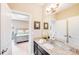 Bathroom with granite countertops, a large mirror, and decor touches, featuring a vanity with storage at 8070 Clems Branch Rd, Indian Land, SC 29707