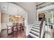 Elegant dining room open to the foyer, features a decorative chandelier and hardwood floors at 8070 Clems Branch Rd, Indian Land, SC 29707