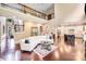 Open-concept layout featuring living area, with kitchen in the background, and beautiful hardwood floors at 8070 Clems Branch Rd, Indian Land, SC 29707