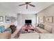 Inviting living room with a sectional sofa, ottoman, and decorative artwork, designed for relaxation at 8070 Clems Branch Rd, Indian Land, SC 29707