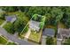 Aerial view of a well-maintained home with a lush, green landscaped yard surrounded by mature trees at 8256 Chatham Oaks Dr, Concord, NC 28027