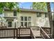 Expansive wooden deck at the rear of the home features ample space for outdoor entertaining and backyard views at 8256 Chatham Oaks Dr, Concord, NC 28027
