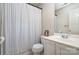The bathroom features a vanity with a sink, toilet, and a shower with a curtain at 8256 Chatham Oaks Dr, Concord, NC 28027