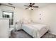 Comfortable bedroom with a window, ceiling fan and an upholstered headboard at 8256 Chatham Oaks Dr, Concord, NC 28027