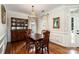 Traditional dining room with hardwood floors, chandelier, china cabinet, and elegant decor at 8256 Chatham Oaks Dr, Concord, NC 28027