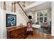 Bright living room boasts high ceilings, a fireplace, ample natural light, and stylish furnishings at 8256 Chatham Oaks Dr, Concord, NC 28027