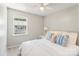 Cozy bedroom with a ceiling fan and a bright window at 8510 Castle Pine Ct, Charlotte, NC 28226