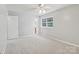 Neutral bedroom showcasing a ceiling fan and window with natural light at 8510 Castle Pine Ct, Charlotte, NC 28226