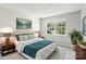 Comfortable bedroom with a large window and serene decor and natural light at 8510 Castle Pine Ct, Charlotte, NC 28226