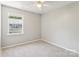 Neutral bedroom with carpeting and a bright window at 8510 Castle Pine Ct, Charlotte, NC 28226