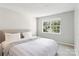 Bedroom with a plush bed and bright window overlooking greenery at 8510 Castle Pine Ct, Charlotte, NC 28226