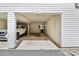 Attached garage with ample space, featuring white walls, shelving, and convenient access to the home at 8510 Castle Pine Ct, Charlotte, NC 28226