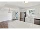 Modern kitchen flows into the dining area and features stainless steel appliances and white cabinetry at 8510 Castle Pine Ct, Charlotte, NC 28226