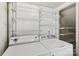 Laundry room featuring a washer, dryer and ample wire shelving at 8510 Castle Pine Ct, Charlotte, NC 28226