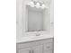 Bathroom vanity offering a large mirror, modern lighting, and sleek countertop at 8510 Castle Pine Ct, Charlotte, NC 28226