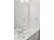 Bathroom vanity featuring a large mirror, chrome faucet, and plenty of counter space at 8510 Castle Pine Ct, Charlotte, NC 28226