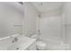 A bright bathroom featuring a shower and tub combination, white toilet, and a white sink at 8524 Emerald Fern Way, Charlotte, NC 28214