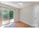 Cozy dining area features laminate flooring and sliding glass door leading to the outdoor patio at 8524 Emerald Fern Way, Charlotte, NC 28214