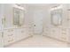 Bright bathroom features a double vanity with gold hardware, a walk-in shower, and tiled floors at 8721 Lake Challis Ln, Charlotte, NC 28226