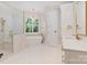 Bathroom features a soaking tub, walk-in shower, and double sink vanity with gold hardware at 8721 Lake Challis Ln, Charlotte, NC 28226