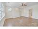 Spacious bedroom with hardwood floors, custom molding, plantation shutters, and natural light at 8721 Lake Challis Ln, Charlotte, NC 28226