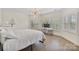 Bright bedroom with hardwood floors, natural light and modern lighting at 8721 Lake Challis Ln, Charlotte, NC 28226