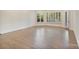 Bonus room has hardwood floors, crown molding, and a window with a view to the yard at 8721 Lake Challis Ln, Charlotte, NC 28226