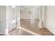 Spacious, bright living room has natural light, hardwood flooring, and classic architectural details at 8721 Lake Challis Ln, Charlotte, NC 28226