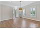 Office/bonus room has hardwood floors, shutters, and double doors to an adjoining room at 8721 Lake Challis Ln, Charlotte, NC 28226